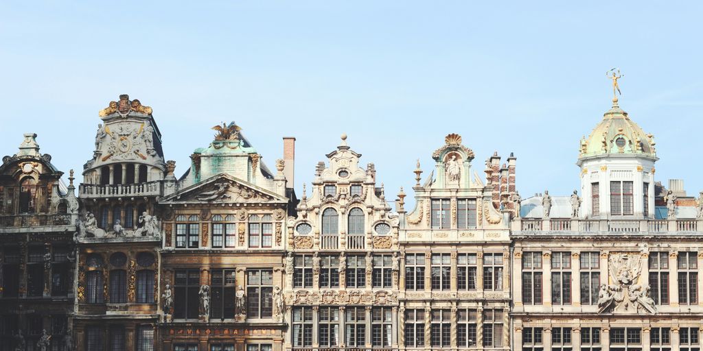 gray and brown building under blue sky